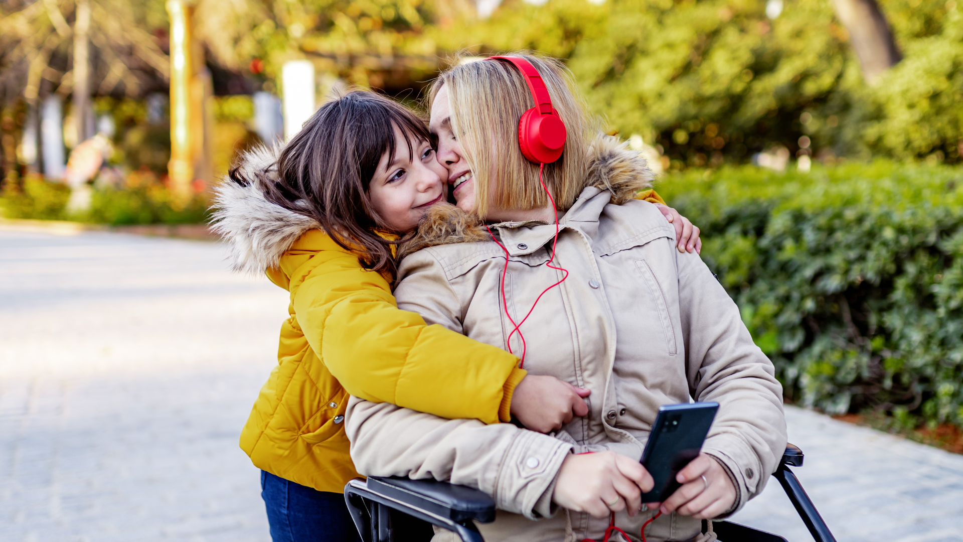 a woman and girl hugging each other