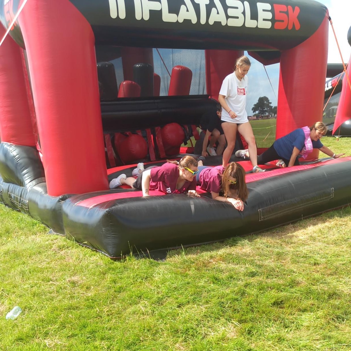 A photo, featuring two ladies immersed in the challenge on the trampoline.