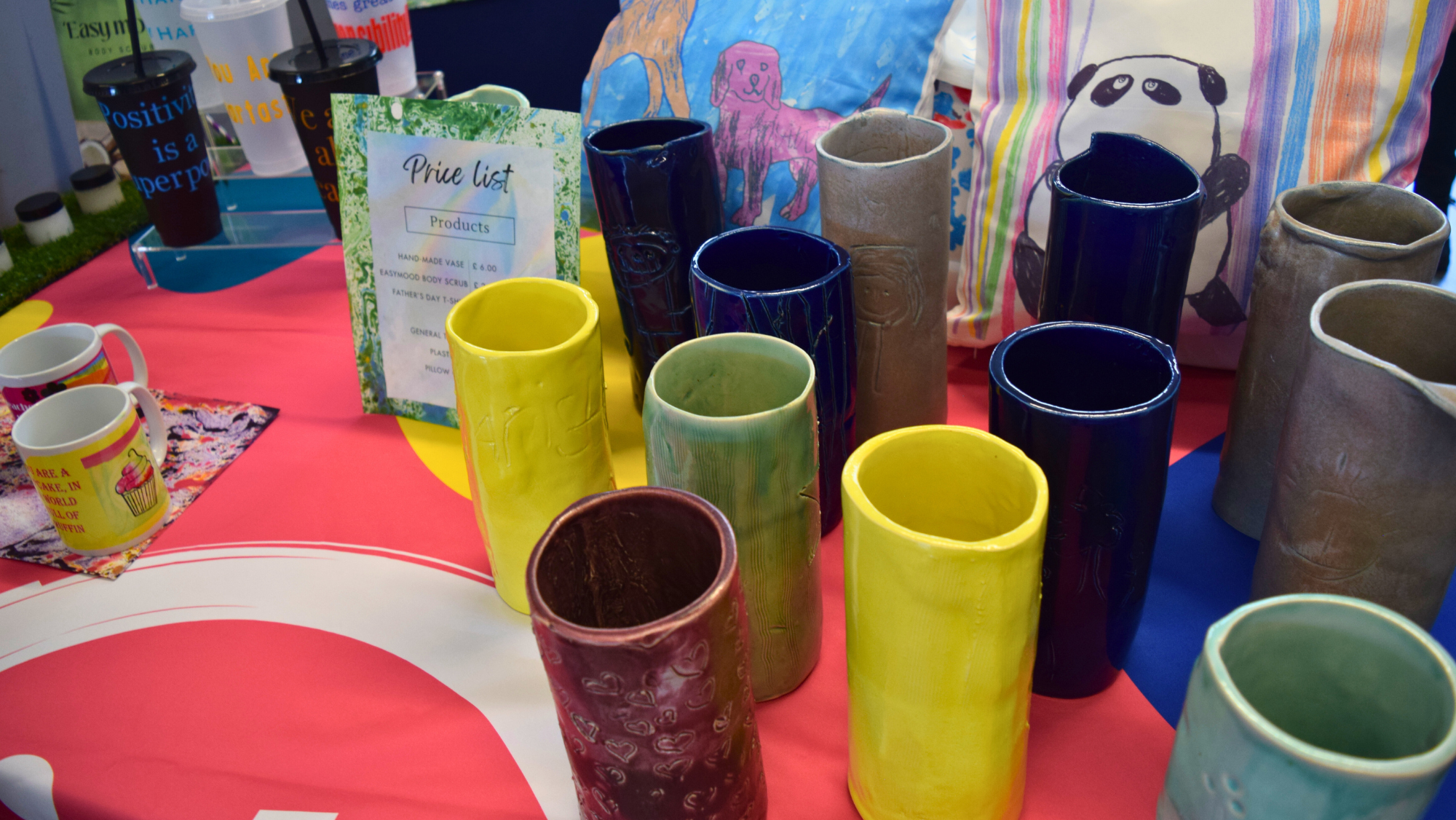 A photo of students hand painted vases for sale