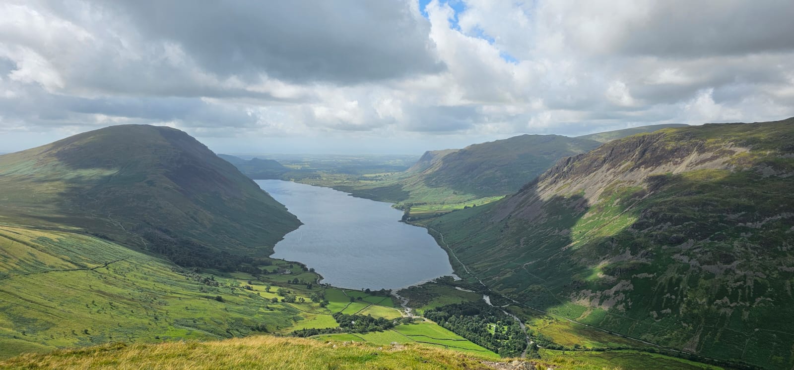 The image captures an aesthetically pleasing panorama that was witnessed during the ascent of Scafell. This challenging climb was successfully accomplished by Lisa and Lee.