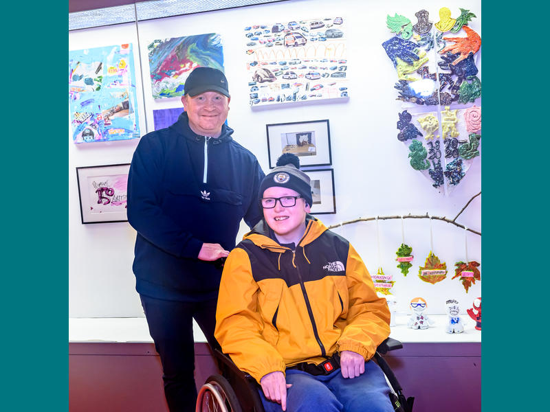 Connor and his dad. Connor is one of our young artists. 