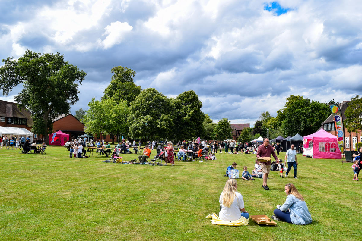 people sat in a field at Join Together Festival