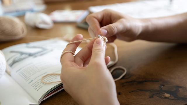 A pair of hands crocheting