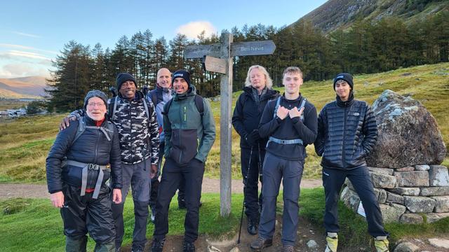 A photo of Kevin Clarke, Registered Manager at Haines House, along with his family and friends, successfully completing the final stage of the Three Peaks Challenge.