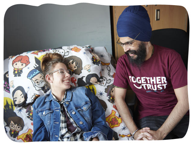 a together trust staff member smiling at a person we support 