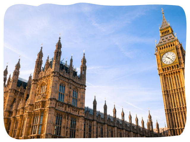 Photo of the Houses of Parliament and Big Ben against a blue sky.